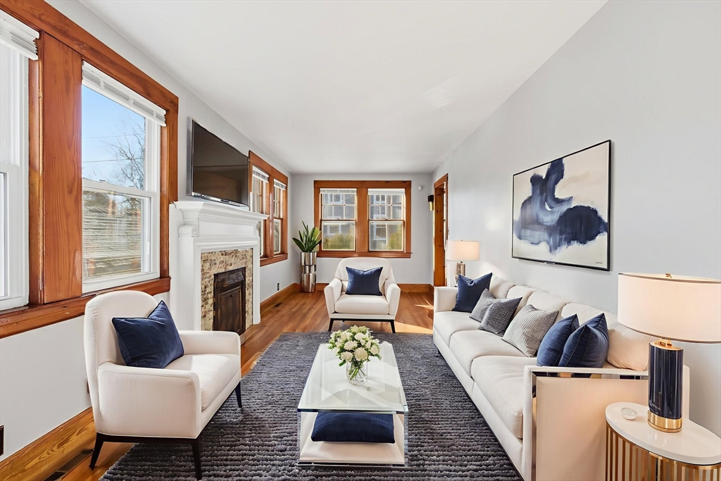 8 Plain Street Randolph, MA 02368 - Photo 12 of 38 a living room with furniture fireplace and a large window