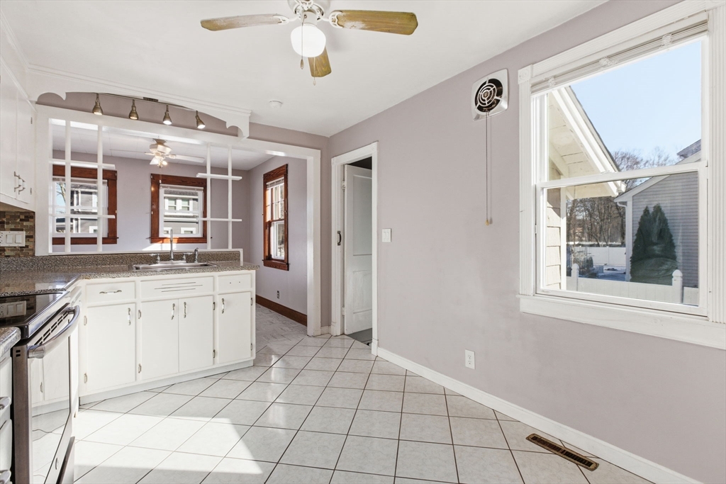 8 Plain Street Randolph, MA 02368 - Photo 14 of 38 a large bathroom with a granite countertop sink mirror and a shower