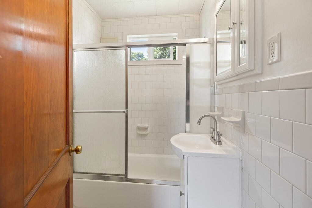 8 Plain Street Randolph, MA 02368 - Photo 15 of 25 a bathroom with a sink and a shower