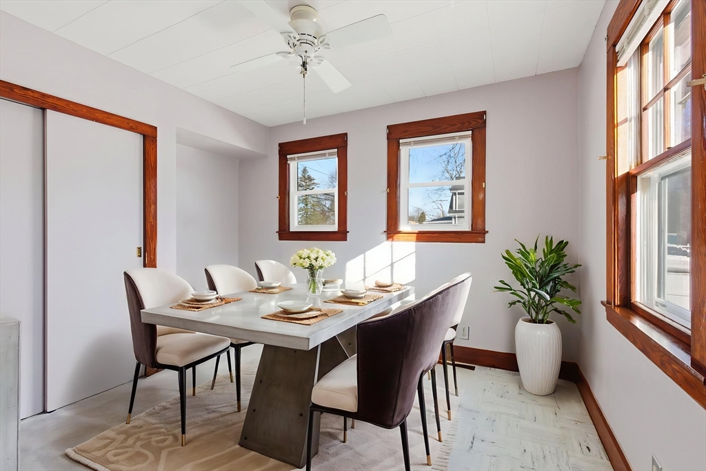 8 Plain Street Randolph, MA 02368 - Photo 18 of 38 a dining room with furniture potted plants and wooden floor