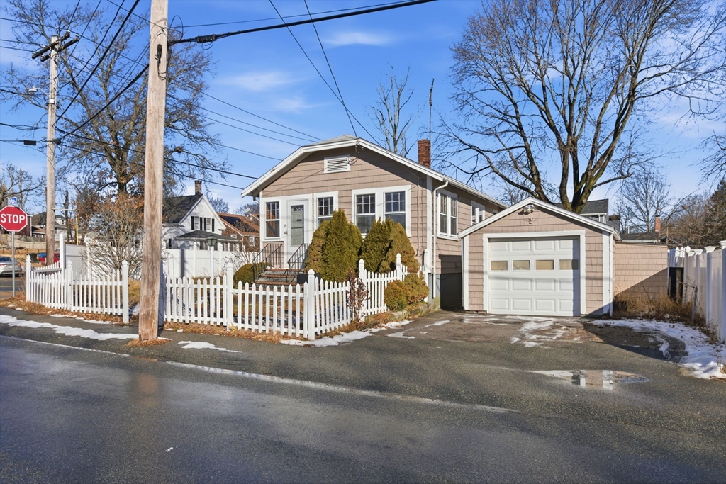 8 Plain Street Randolph, MA 02368 - Photo 2 of 38 a front view of a house with a garden