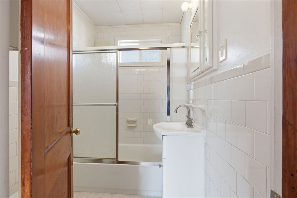 8 Plain Street Randolph, MA 02368 - Photo 21 of 38 a bathroom with a sink and a mirror