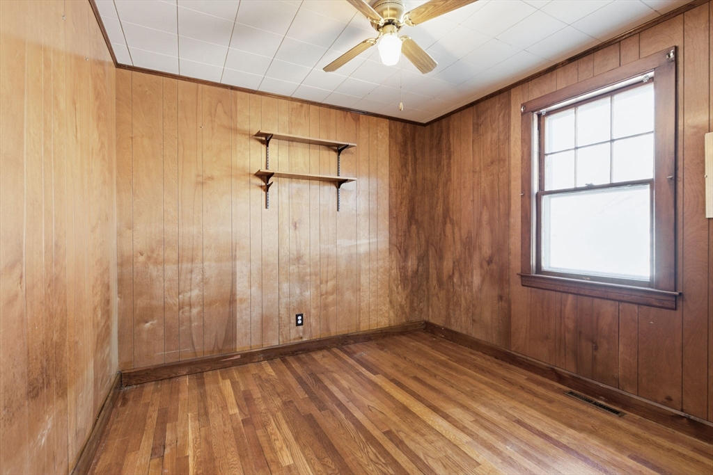 8 Plain Street Randolph, MA 02368 - Photo 24 of 38 wooden floor in an empty room with a window