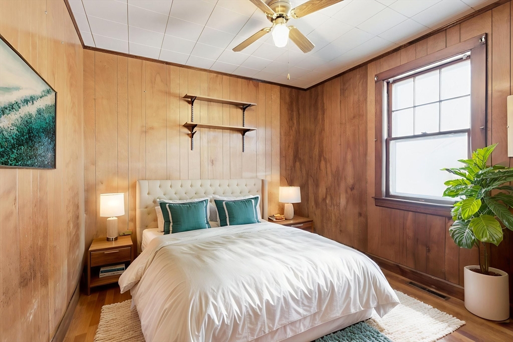 8 Plain Street Randolph, MA 02368 - Photo 25 of 38 a bedroom with a bed and a potted plant