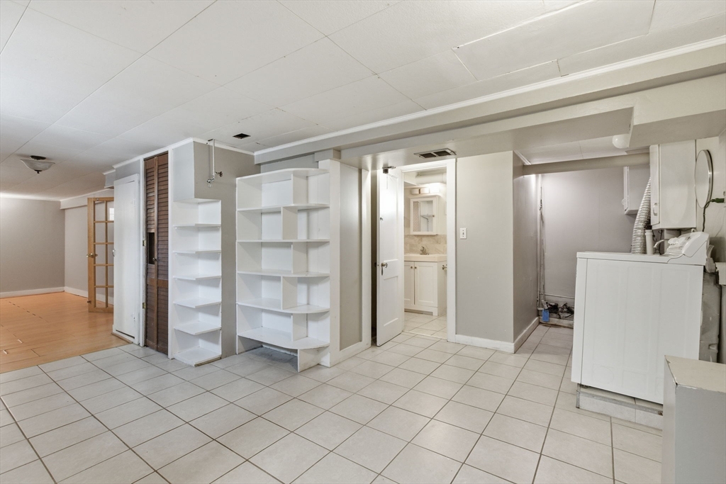 8 Plain Street Randolph, MA 02368 - Photo 27 of 38 a view of walk in closet with clothes and shoes