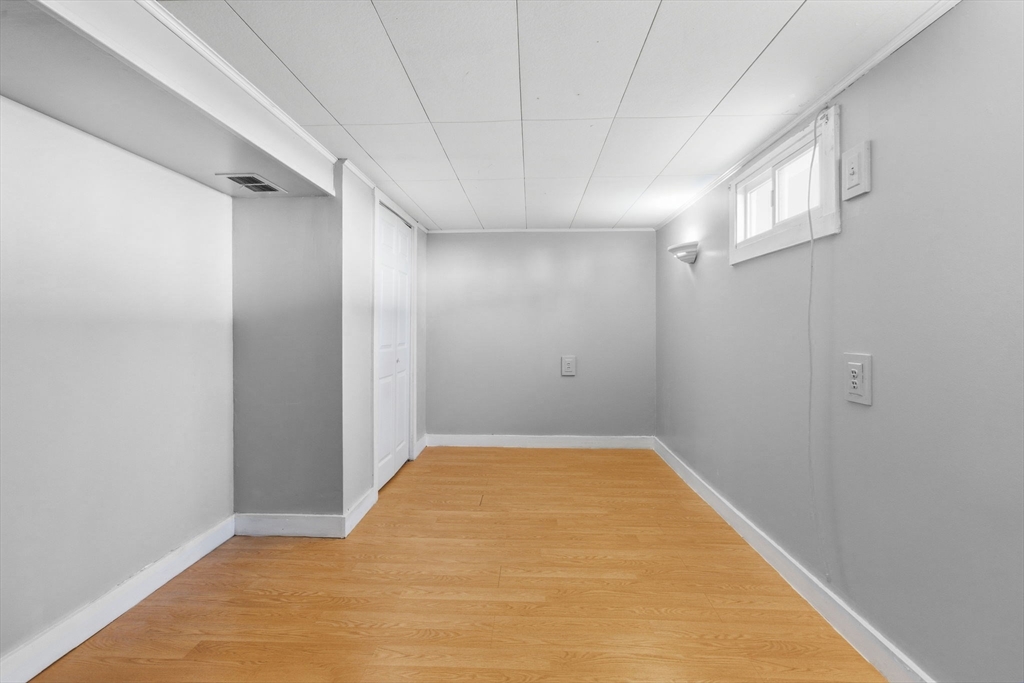 8 Plain Street Randolph, MA 02368 - Photo 35 of 38 a view of a big room with closet and windows