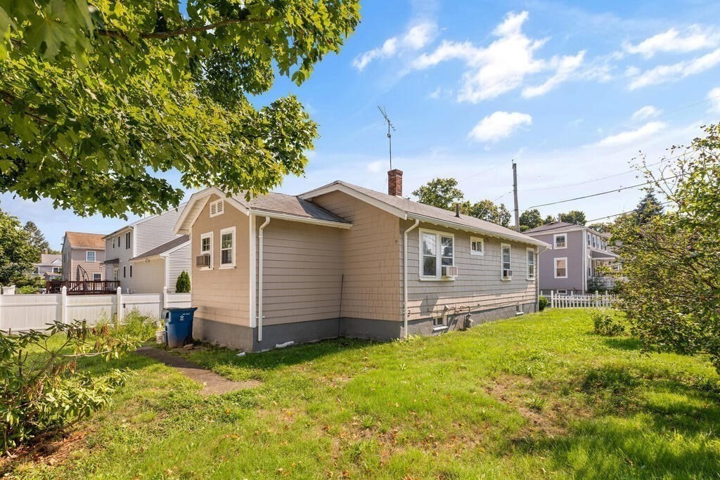 8 Plain Street Randolph, MA 02368 - Photo 4 of 25 a house view with a garden space