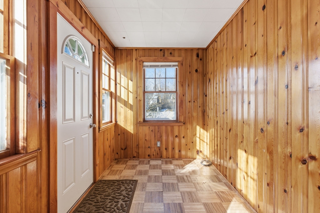 8 Plain Street Randolph, MA 02368 - Photo 6 of 38 a view of a hallway with wooden floor and windows