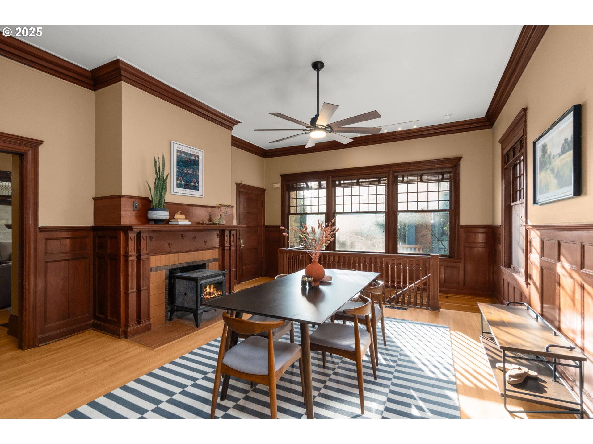 333 Northwest 20th Avenue, Unit 2 Portland, OR 97209 - Photo 4 of 28 a dining room with furniture a chandelier and wooden floor