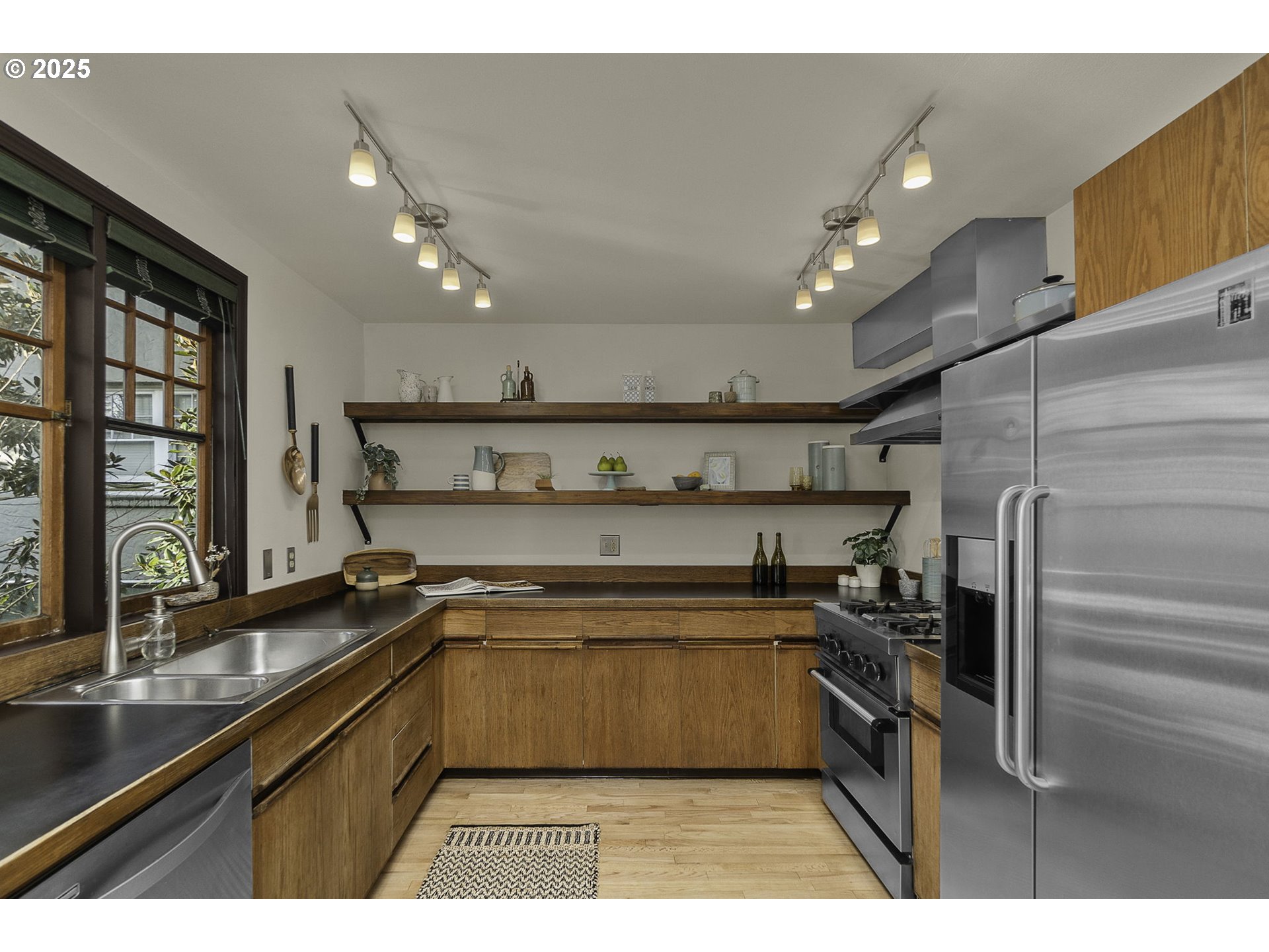 333 Northwest 20th Avenue, Unit 2 Portland, OR 97209 - Photo 7 of 28 a kitchen with a sink stainless steel appliances and cabinets