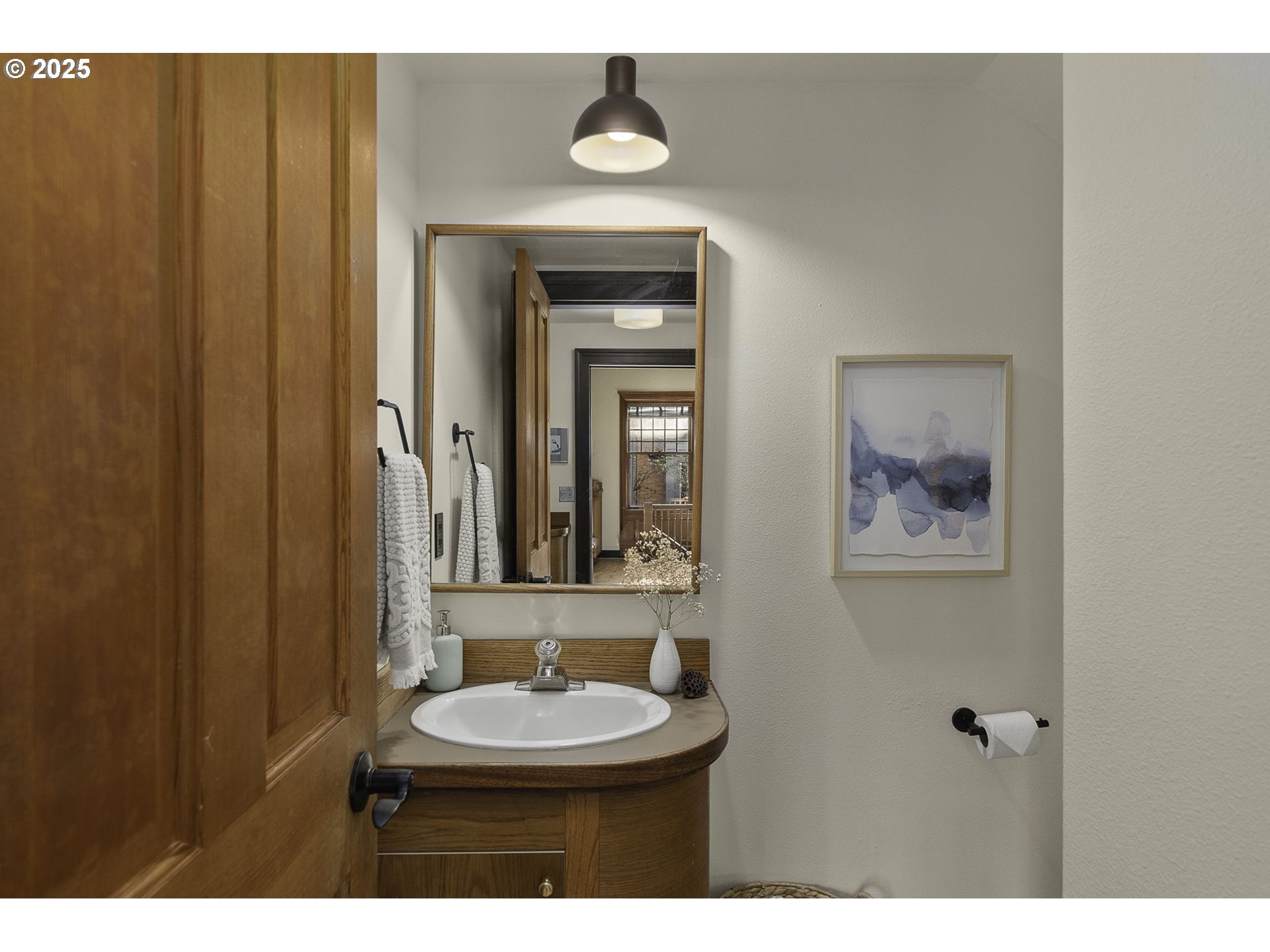 333 Northwest 20th Avenue, Unit 2 Portland, OR 97209 - Photo 10 of 28 a bathroom with a toilet sink and mirror