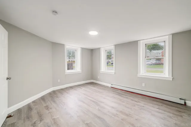 a view of an empty room with a window