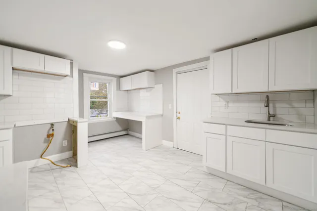 a view of cabinets and window