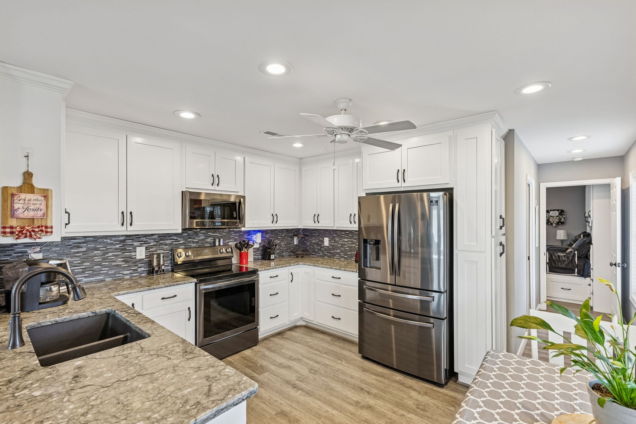 403 Bland Road Estill Springs, TN 37330 - Photo 13 of 53 a kitchen with stainless steel appliances and a stove top oven
