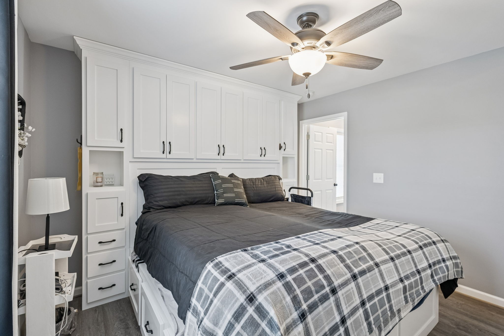 403 Bland Road Estill Springs, TN 37330 - Photo 26 of 53 a bedroom with a bed and a chandelier