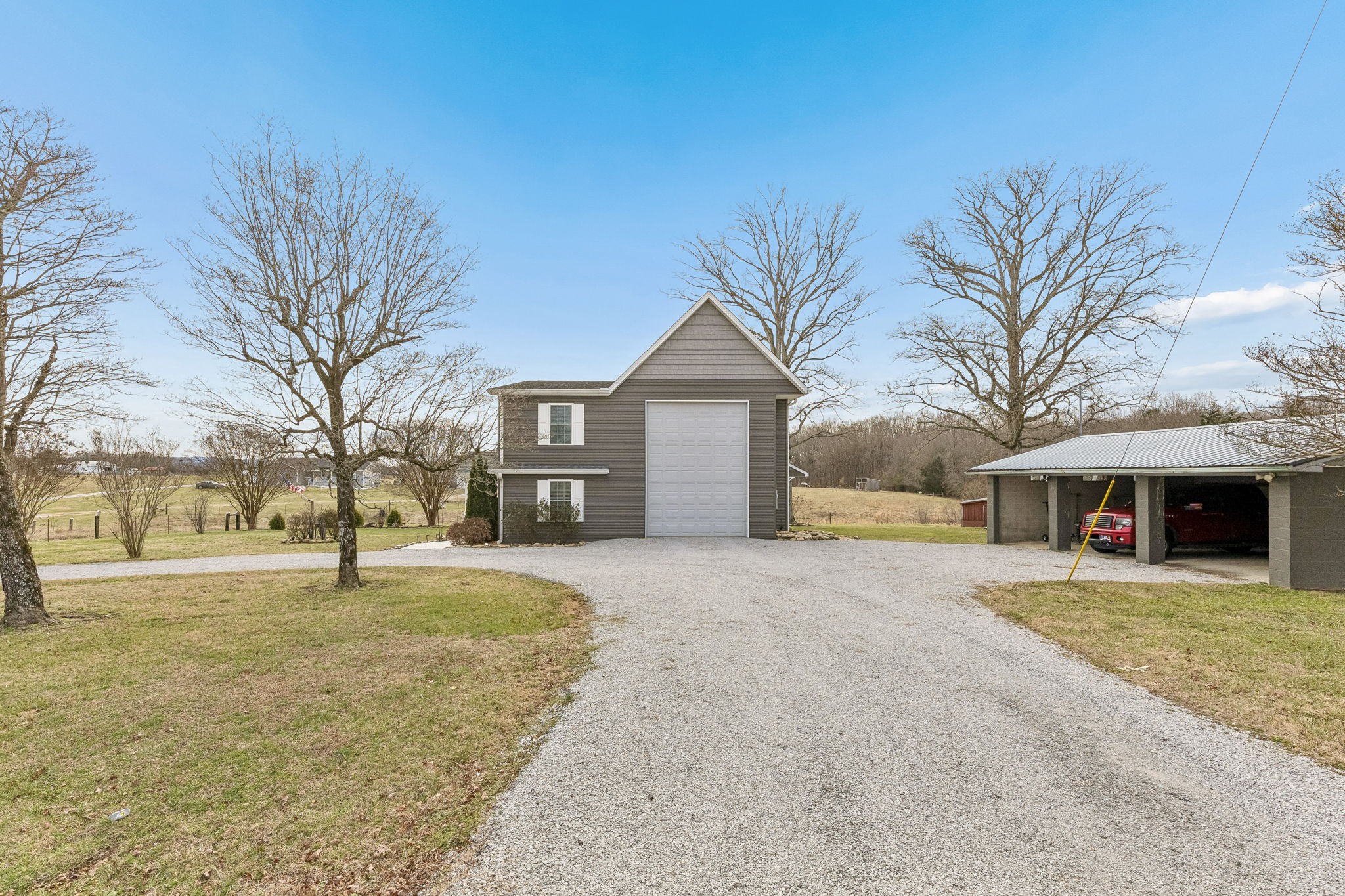 403 Bland Road Estill Springs, TN 37330 - Photo 38 of 53 a front view of a house with a yard and garage