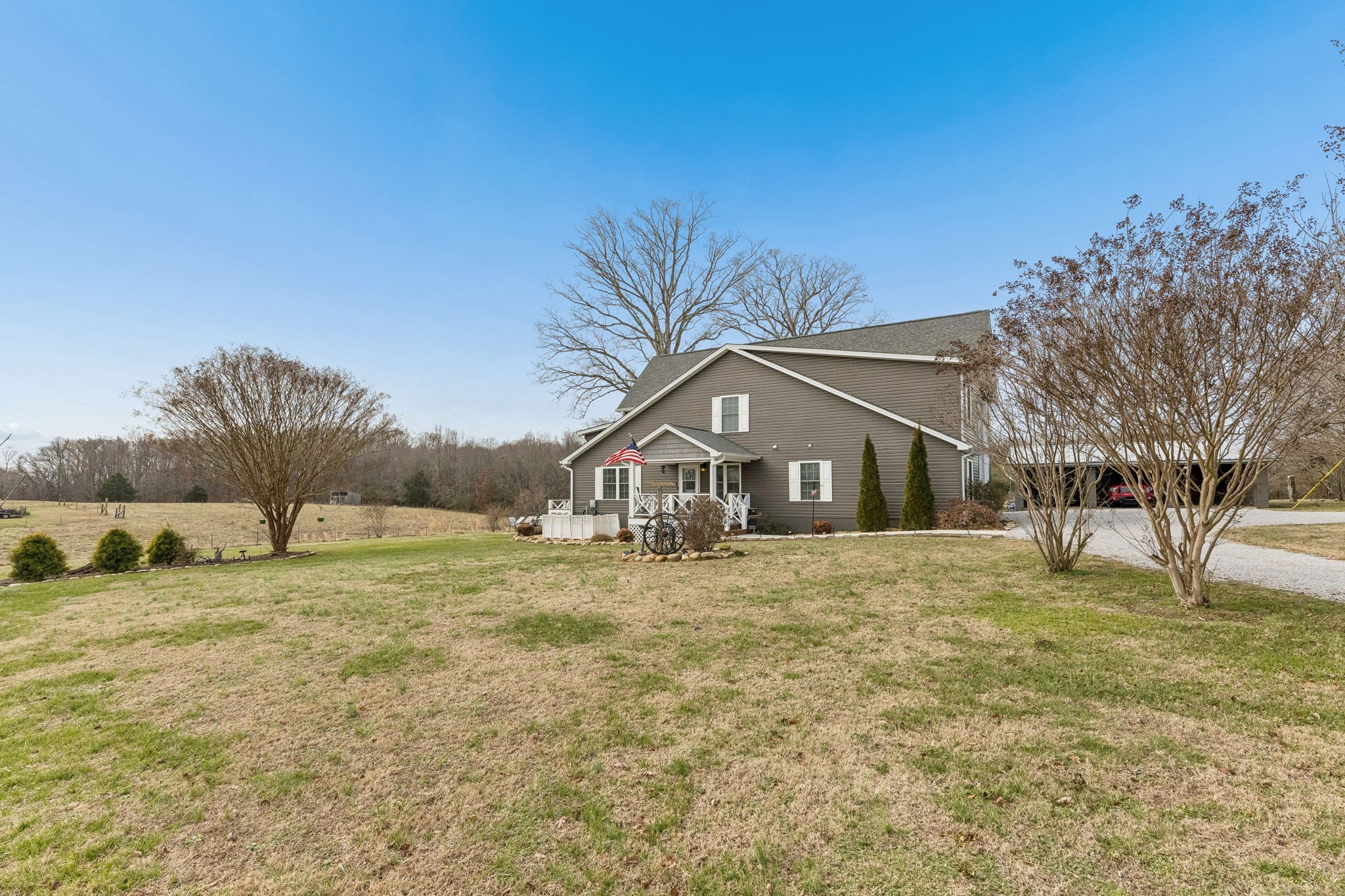 403 Bland Road Estill Springs, TN 37330 - Photo 7 of 53 a big house with a big yard and large trees