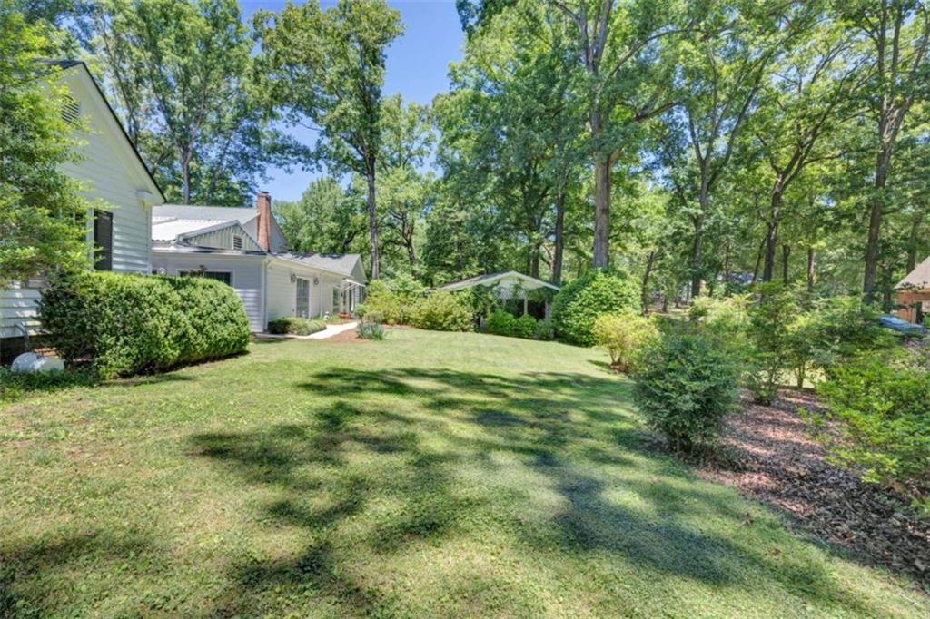 103 Gabriel Way Social Circle, GA 30025 - Photo 56 of 70 a backyard of a house with lots of green space