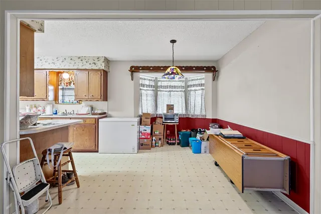 a room with furniture a window and a chandelier