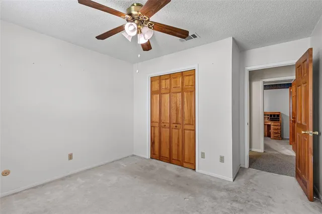a kitchen with stainless steel appliances granite countertop a refrigerator and a stove