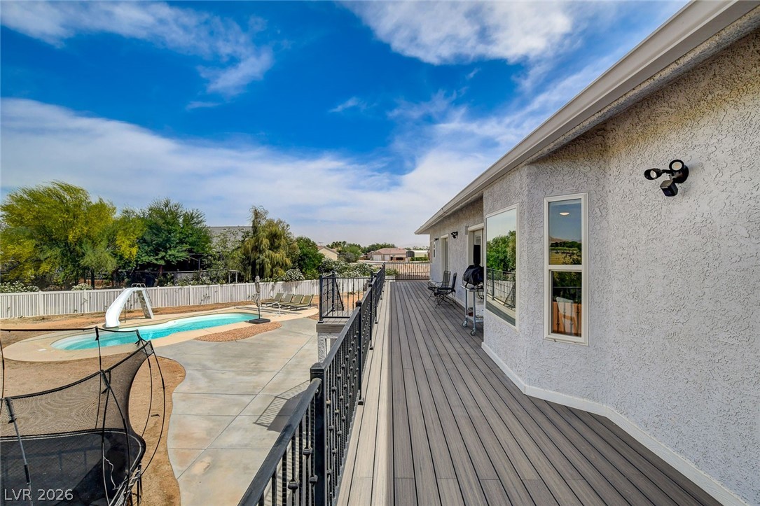 4362 Thistle Street Logandale, NV 89021 - Photo 69 of 99 An inviting deck overlooks the private pool, perfect for outdoor entertaining.