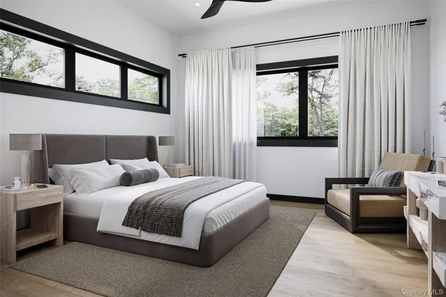 a bedroom with a bed couch and window