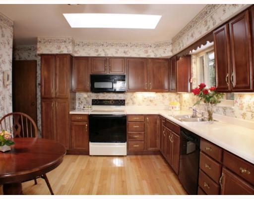 421 Sangree Road Pittsburgh, PA 15237 - Photo 6 of 18 Kitchen. Remodeled with Corian counters and cherry cabinetry with matching hutch and pantry. Hardwood flooring. Eat-in-kitchen. All appliances included.