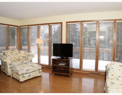 421 Sangree Road Pittsburgh, PA 15237 - Photo 8 of 18 Den/Family/Great Room. Walls of windows allow for great, natural lighting, and enjoment of nature. Glass paneled Frech doors, hand made, built-in bookcases., hardwood flooring, powder room, and access to rear deck.