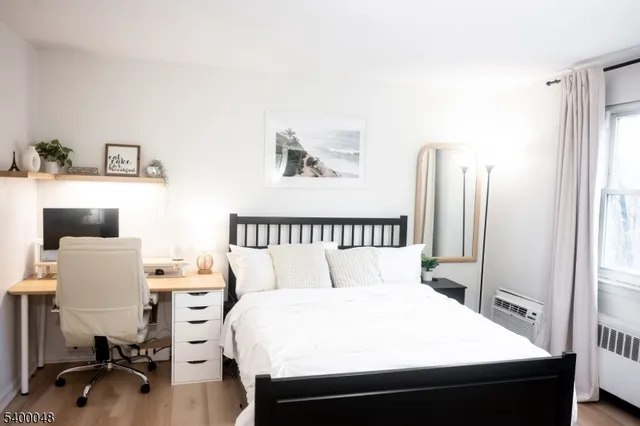 a bedroom with a bed and a table in it