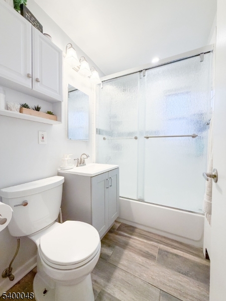 300 Wilson Road, Unit 24D Springfield, NJ 07081 - Photo 9 of 11 a bathroom with a sink toilet and shower