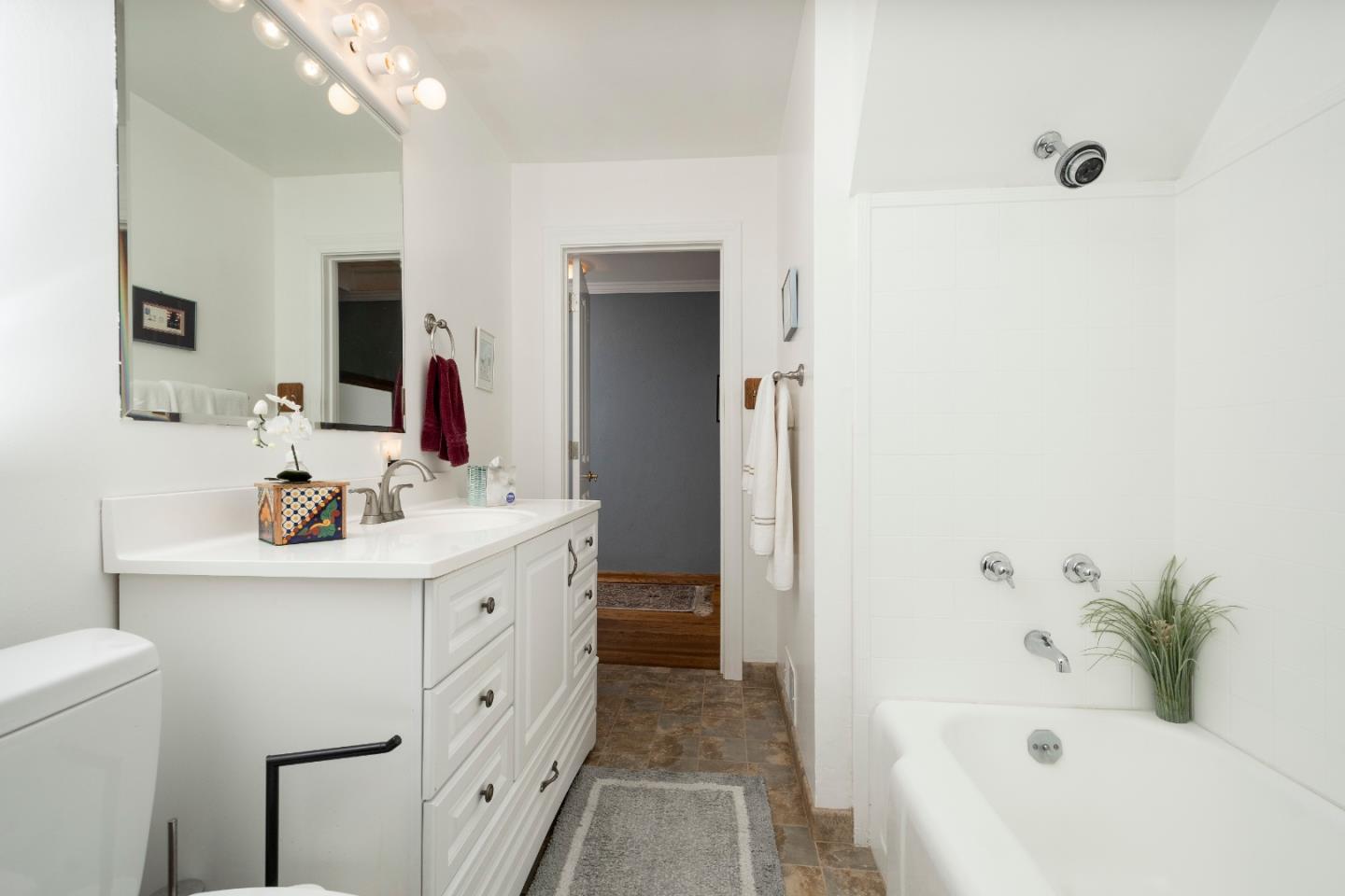 9 La Mancha Place Millbrae, CA 94030 - Photo 12 of 20 a bathroom with a bathtub sink and mirror