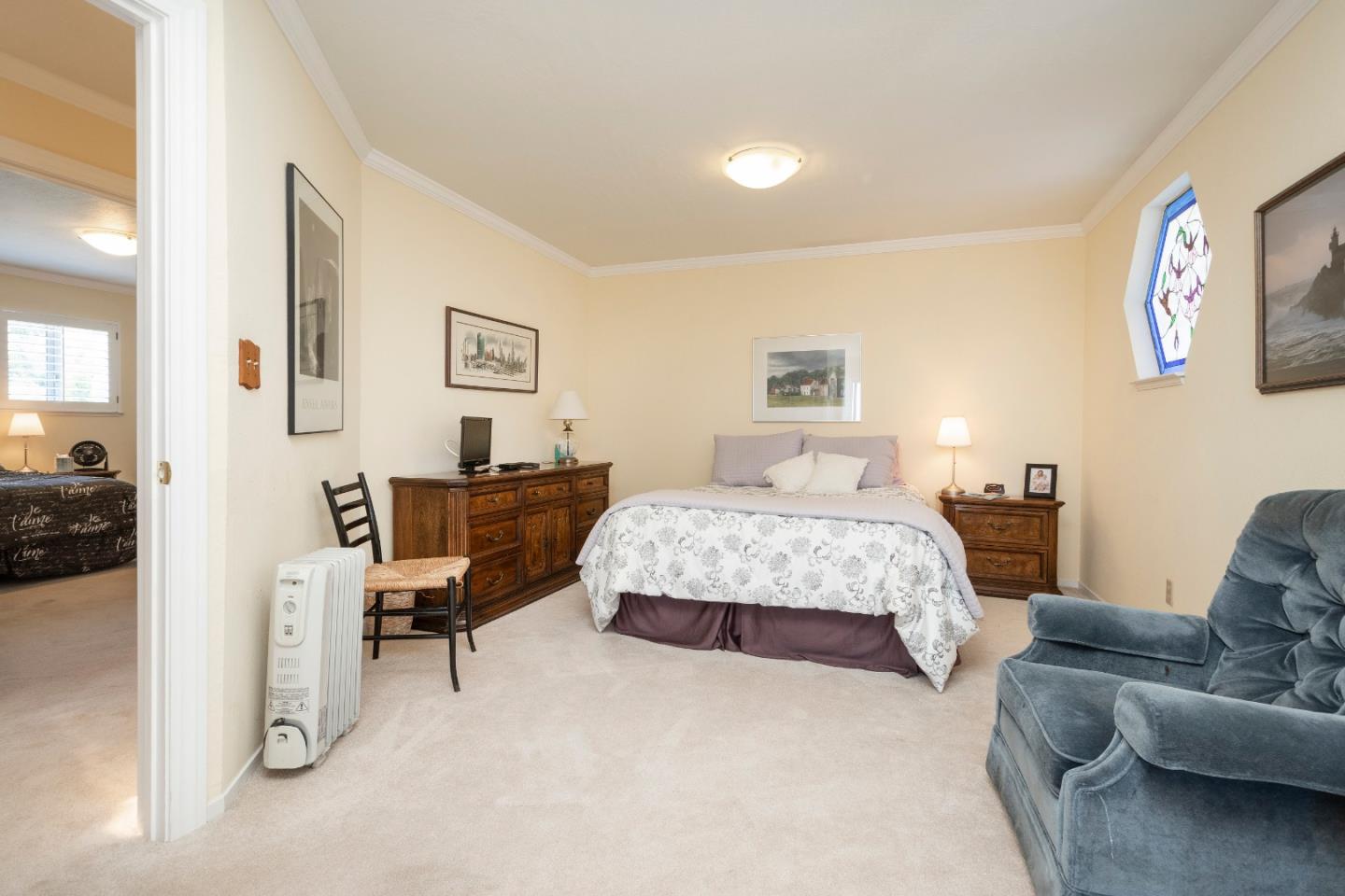 9 La Mancha Place Millbrae, CA 94030 - Photo 13 of 20 a bedroom with a bed couch and a view of living room