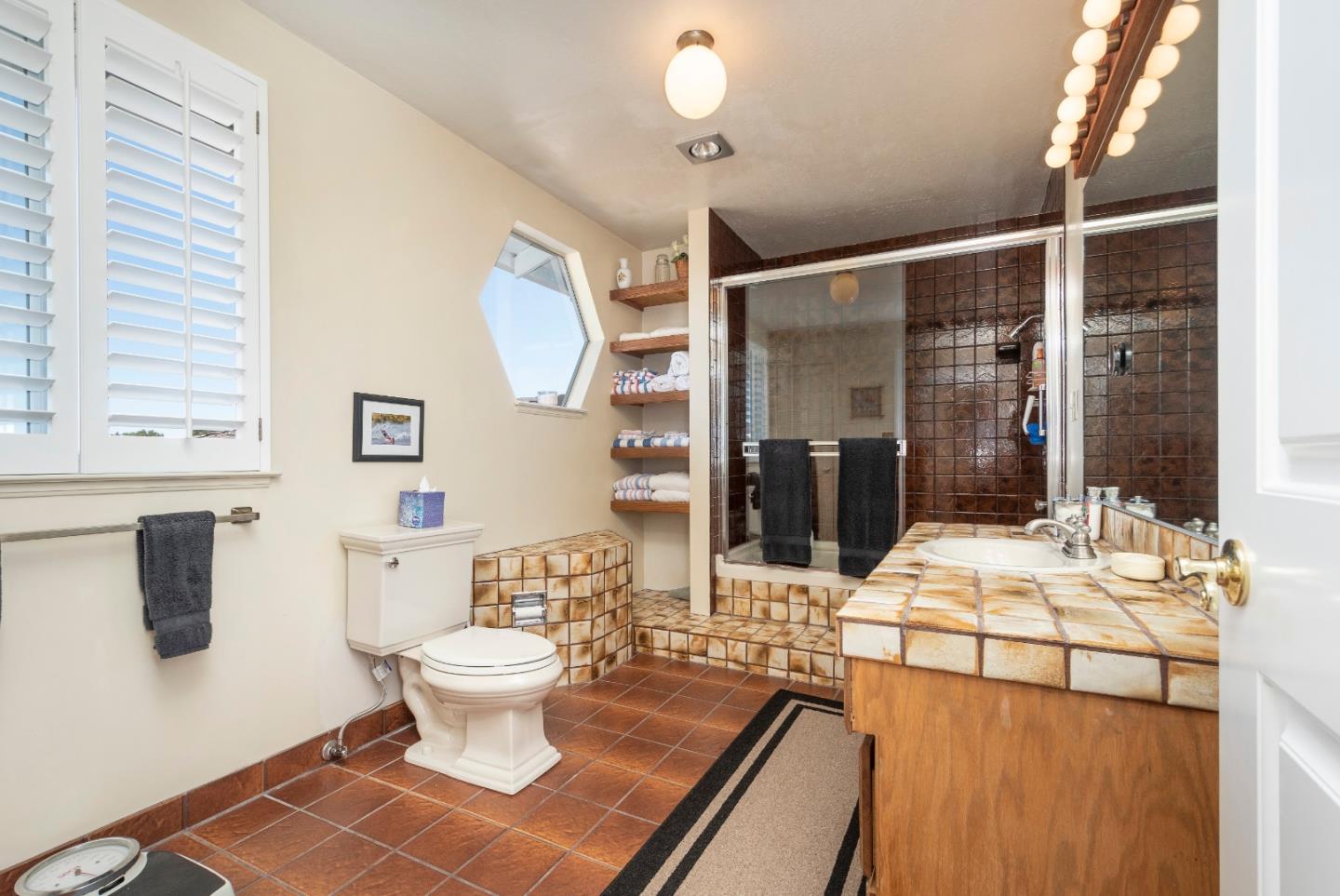 9 La Mancha Place Millbrae, CA 94030 - Photo 16 of 20 a bathroom with a sink mirror and toilet