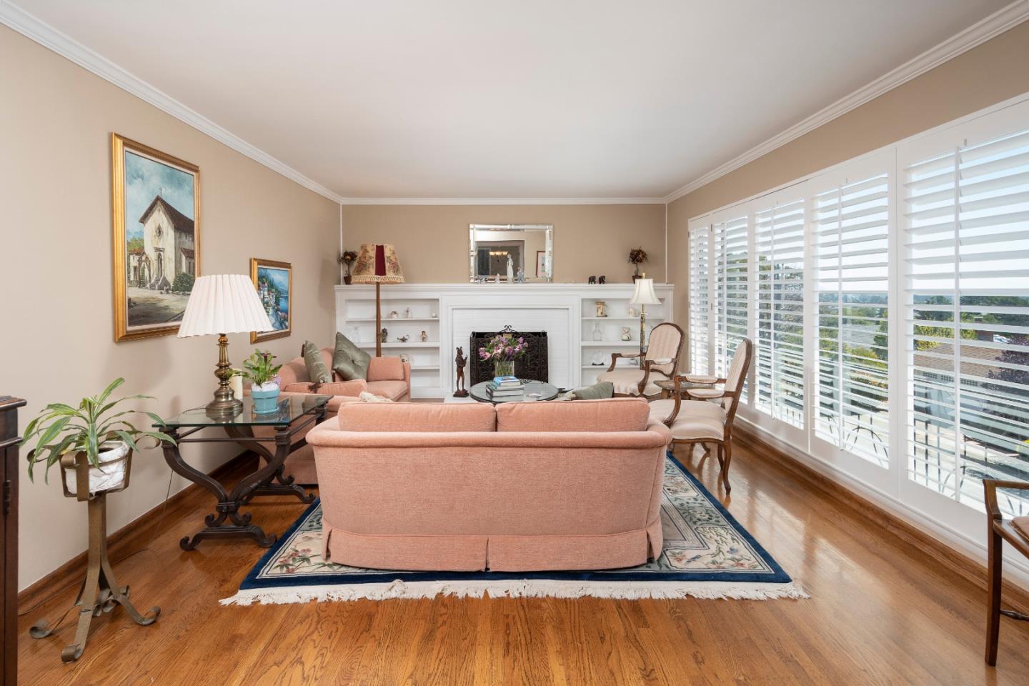 9 La Mancha Place Millbrae, CA 94030 - Photo 3 of 20 a living room with furniture and a fireplace