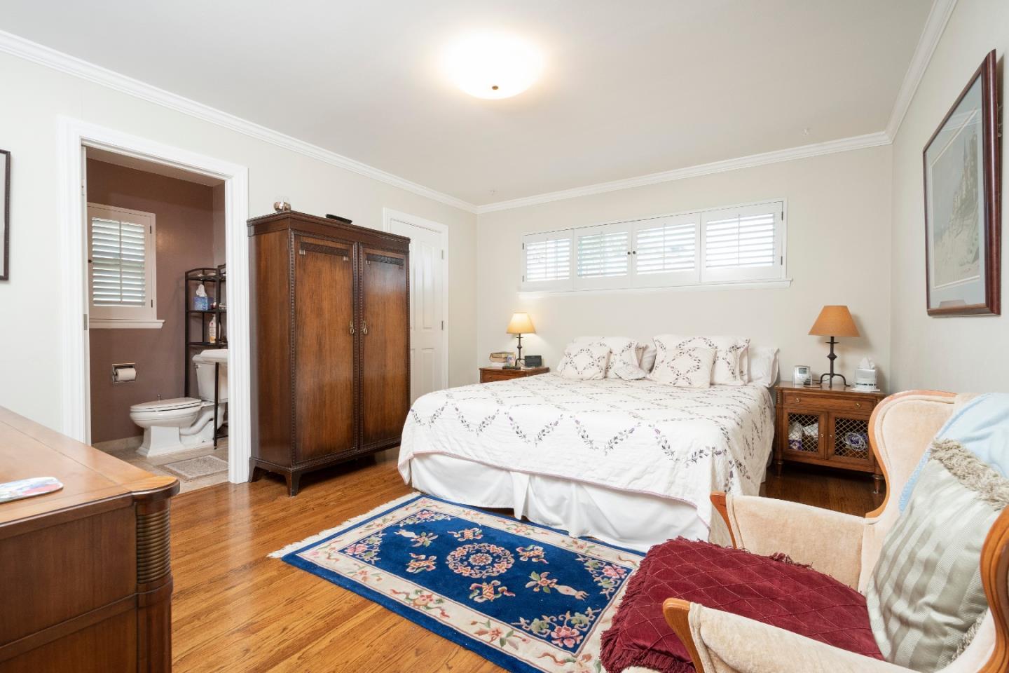 9 La Mancha Place Millbrae, CA 94030 - Photo 9 of 20 a bedroom with a bed and wooden floor