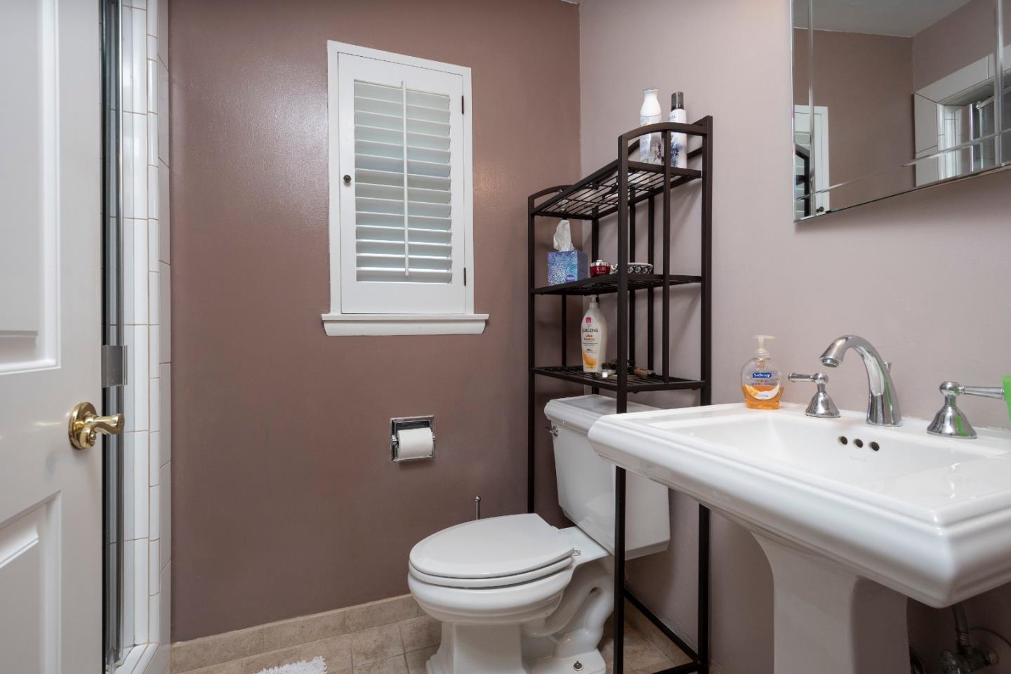 9 La Mancha Place Millbrae, CA 94030 - Photo 10 of 20 a bathroom with a sink toilet and shower