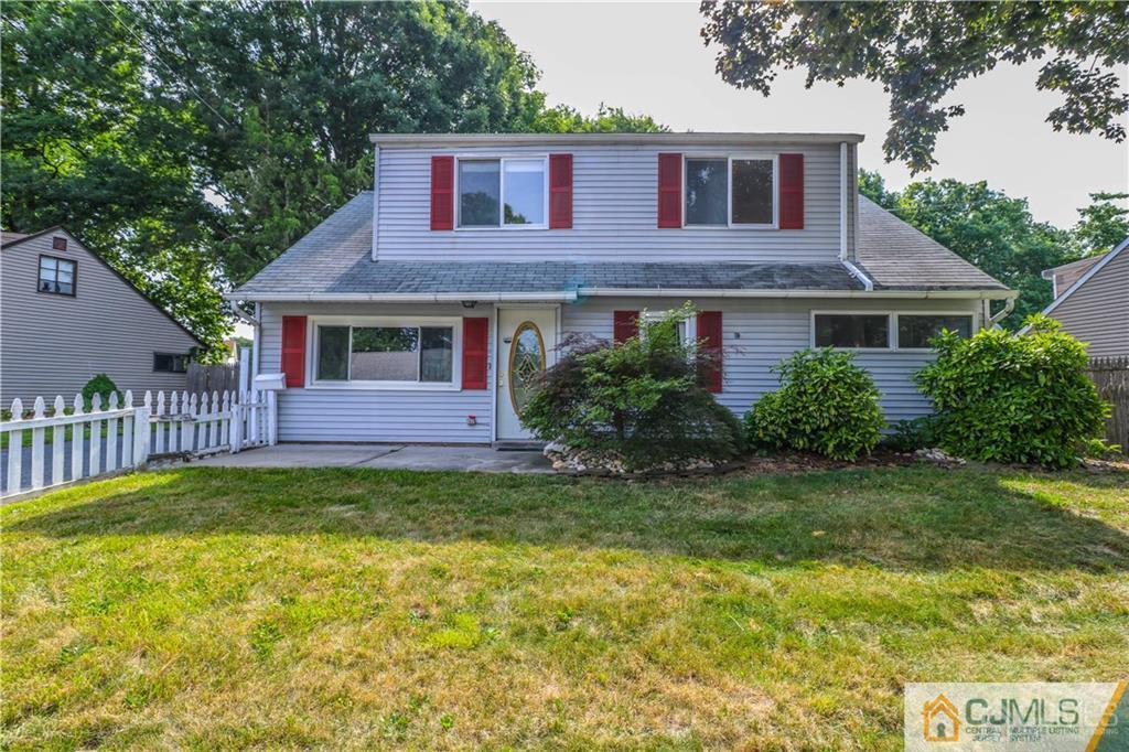 20 Sturgis Road Edison, NJ 08817 - Photo 1 of 25 a view of a yard in front of a house with plants and large trees