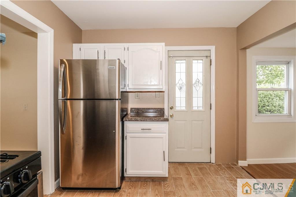 20 Sturgis Road Edison, NJ 08817 - Photo 14 of 25 a kitchen with a refrigerator and a stove