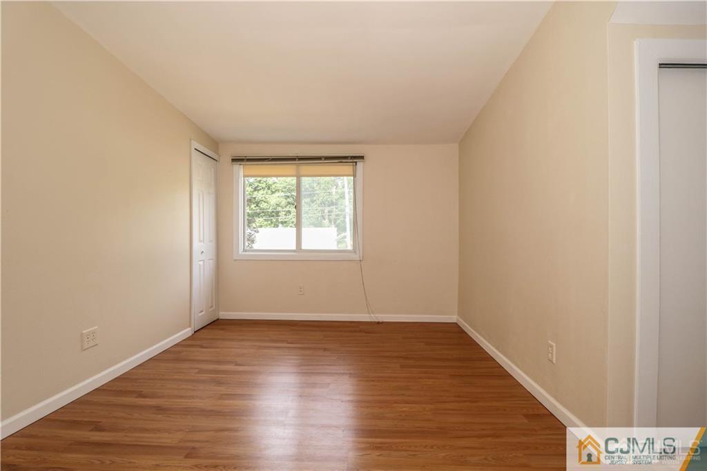 20 Sturgis Road Edison, NJ 08817 - Photo 9 of 25 wooden floor in an empty room with a window
