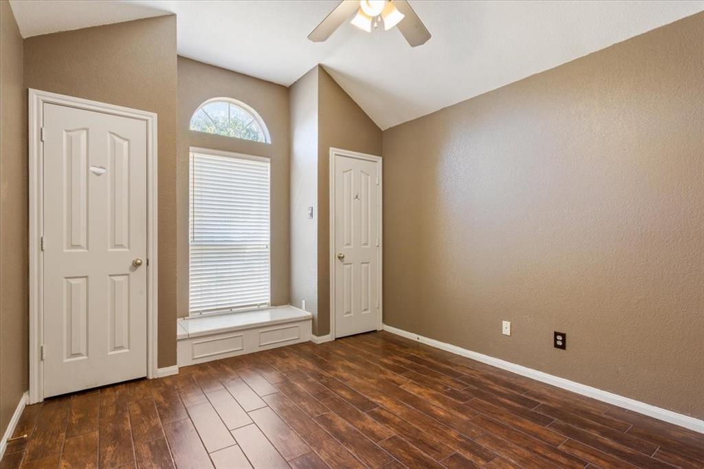 736 Tahoe Trail Hewitt, TX 76643 - Photo 21 of 30 Foyer entrance with lofted ceiling, dark wood-type flooring, ceiling fan, and a textured wall
