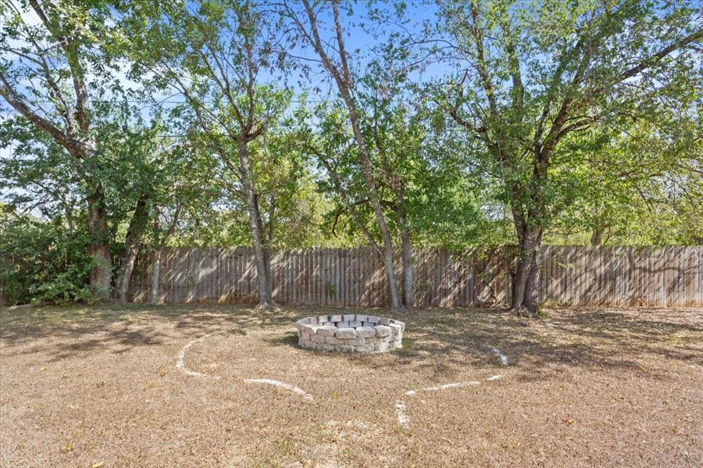 736 Tahoe Trail Hewitt, TX 76643 - Photo 28 of 30 Fenced backyard featuring a fire pit