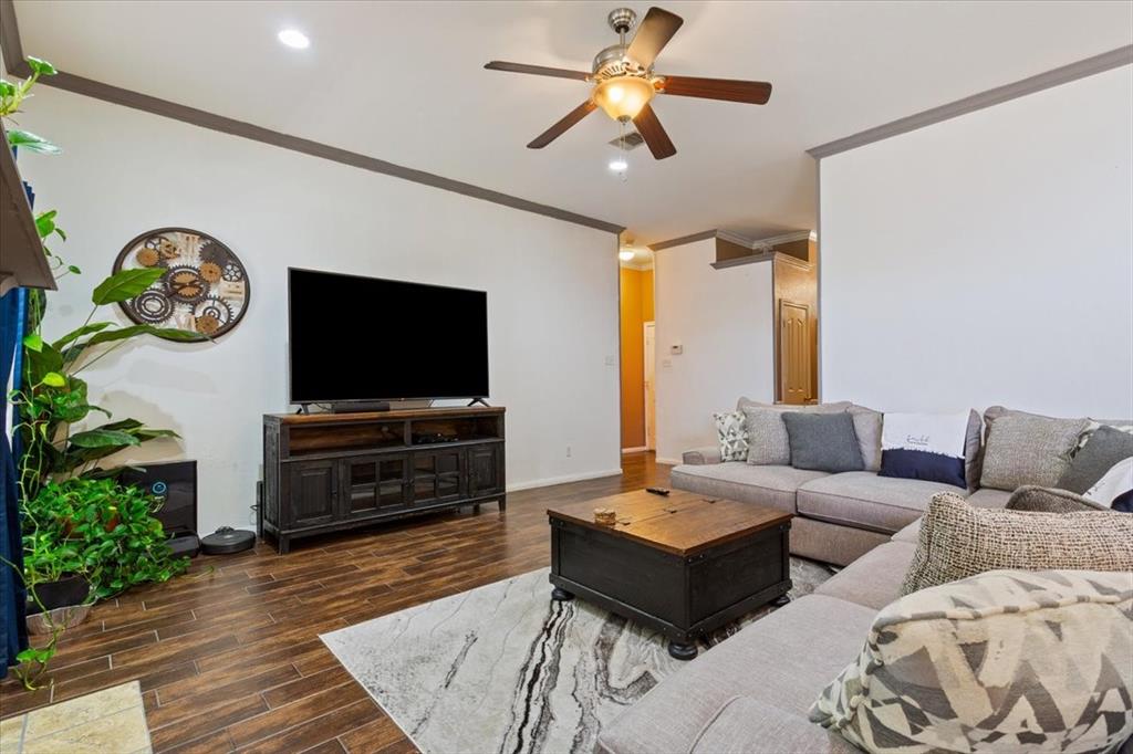 736 Tahoe Trail Hewitt, TX 76643 - Photo 5 of 30 Living room featuring crown molding, dark wood-style floors, ceiling fan, and recessed lighting