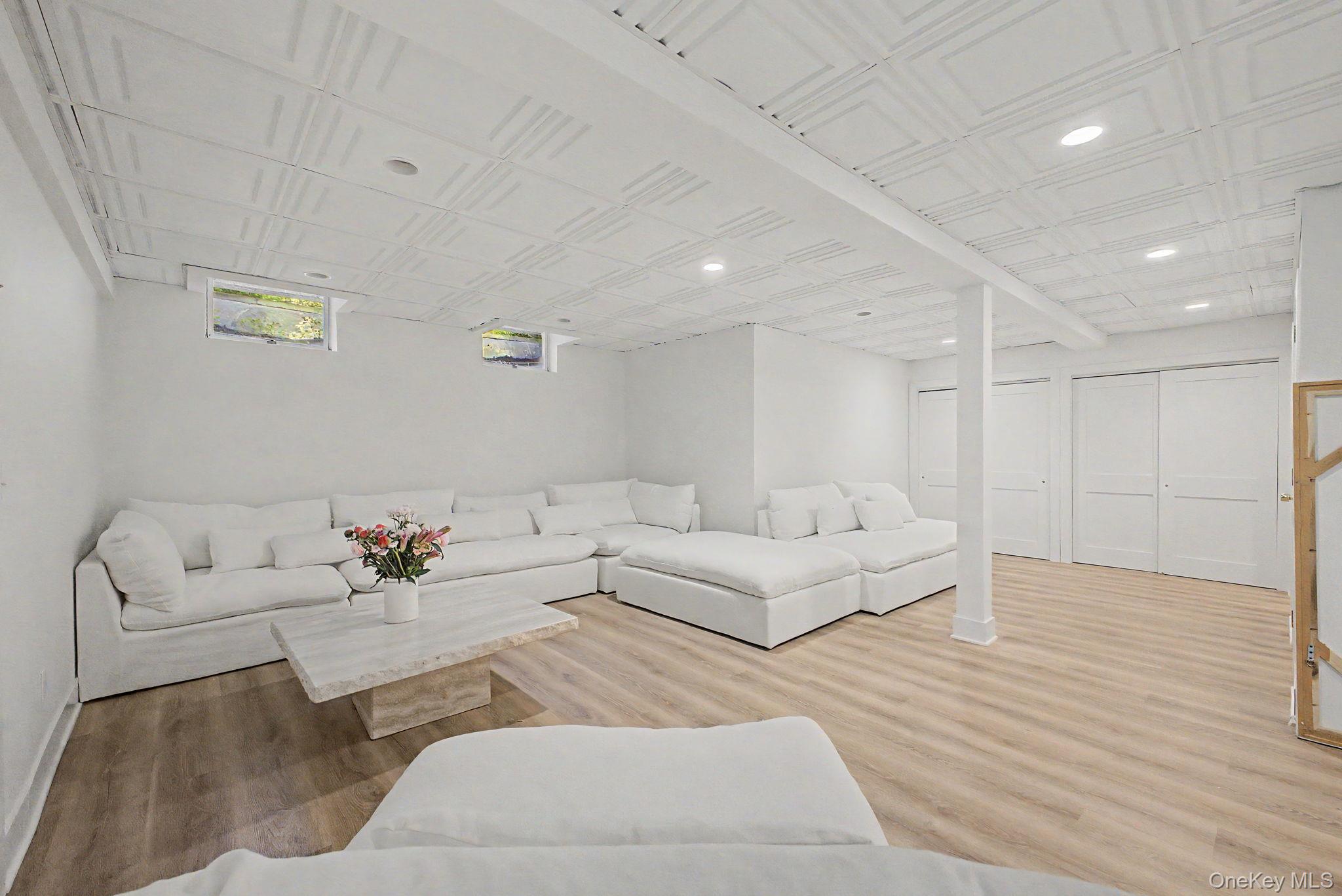 240 Eastwoods Road Pound Ridge, NY 10576 - Photo 37 of 46 a living room with furniture and white walls