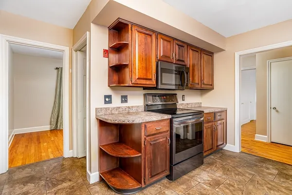 a kitchen with stainless steel appliances granite countertop a stove and a sink