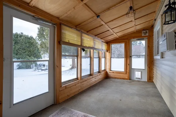 a view of an empty room with a large window