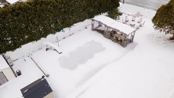 a white house covered with snow