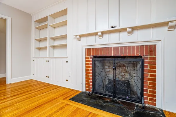 a bedroom with a fireplace