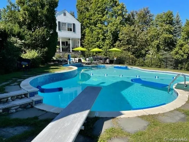a view of a swimming pool with chairs