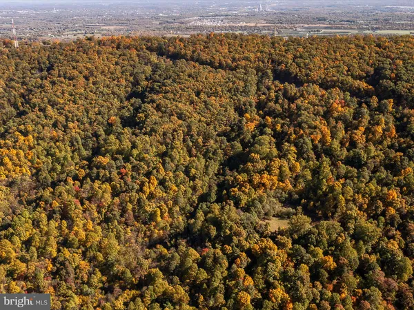 an aerial view of residential house and green space