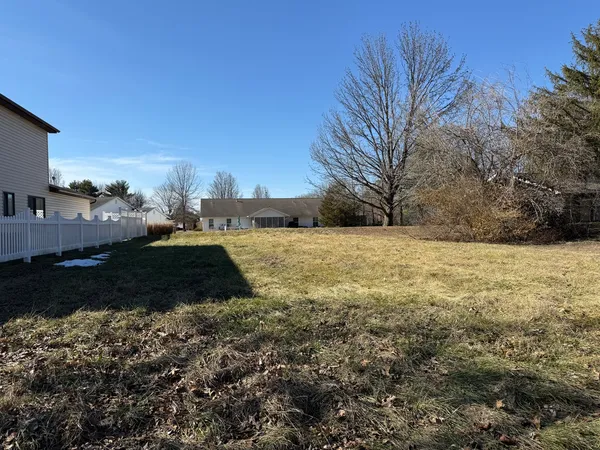 a view of a yard with an trees